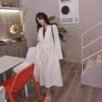 A minimalist mid-length woolen coat