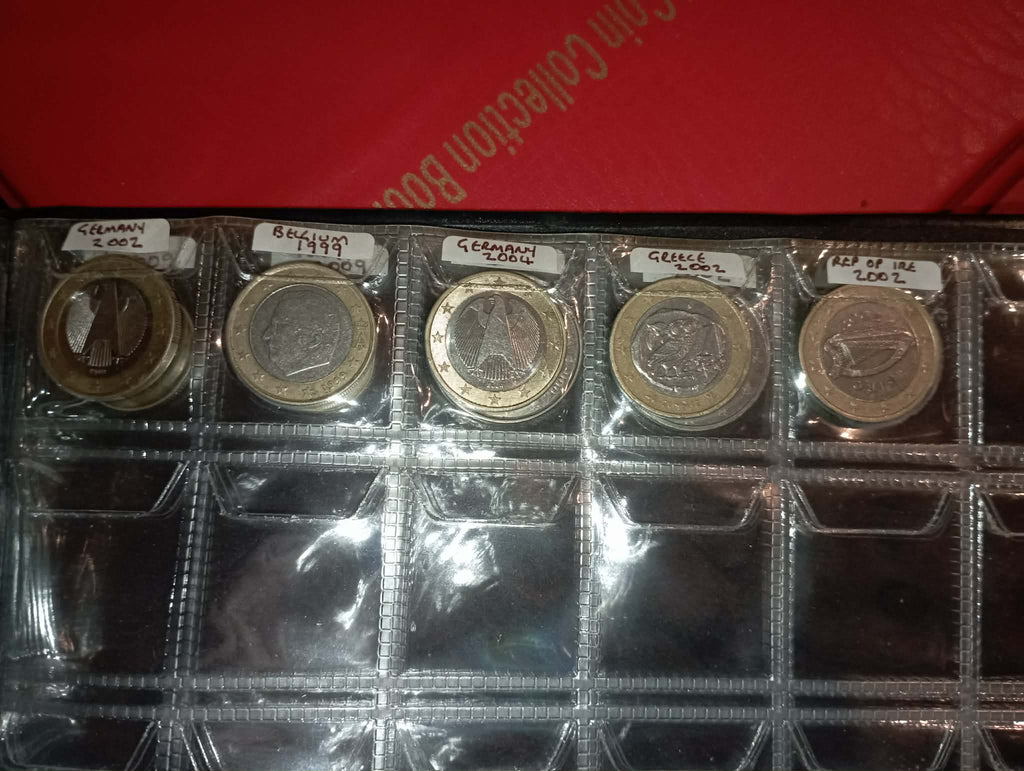 RED COIN BOOK WITH 44 CENT AND EURO COINS