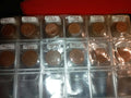 RED COIN BOOK WITH 44 CENT AND EURO COINS
