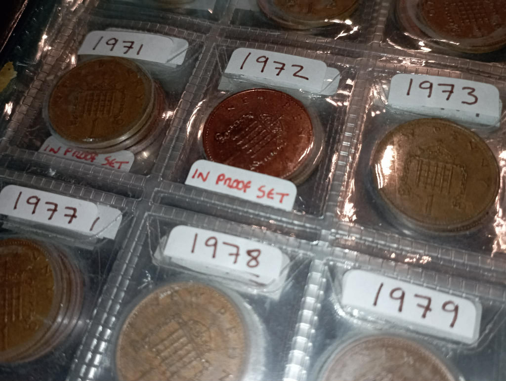 RED COIN BOOK WITH 45 BRITISH 1P COINS