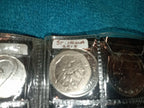 RED COIN BOOK WITH 13 COINS