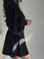 Black Two-Piece Set With Textured Strapless Top And Flared Mini Skirt