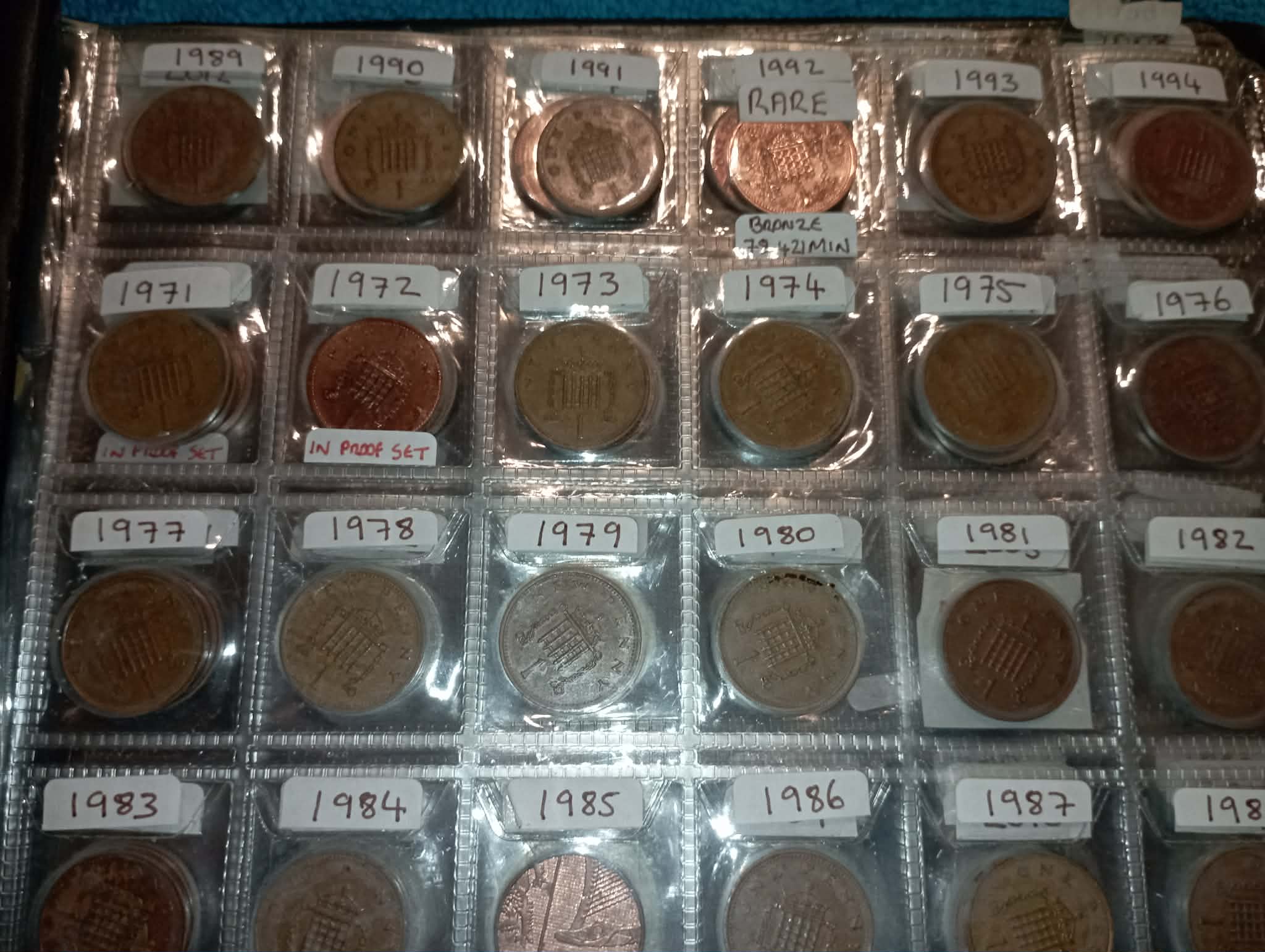RED COIN BOOK WITH 45 BRITISH 1P COINS