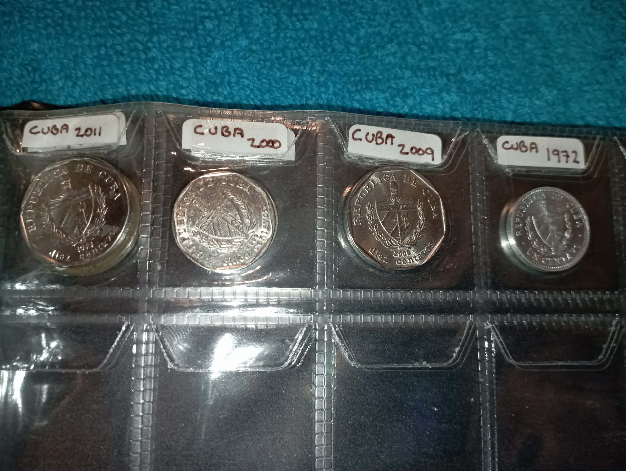 RED COIN BOOK WITH 11 COINS