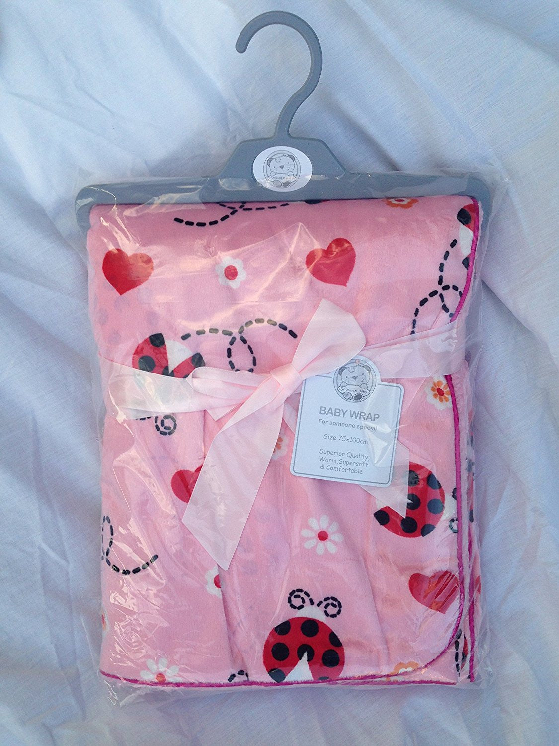 SOFT FLEECY BABY WRAP OR BLANKET 75CMS X 100CMS PINK WITH LADYBIRDS