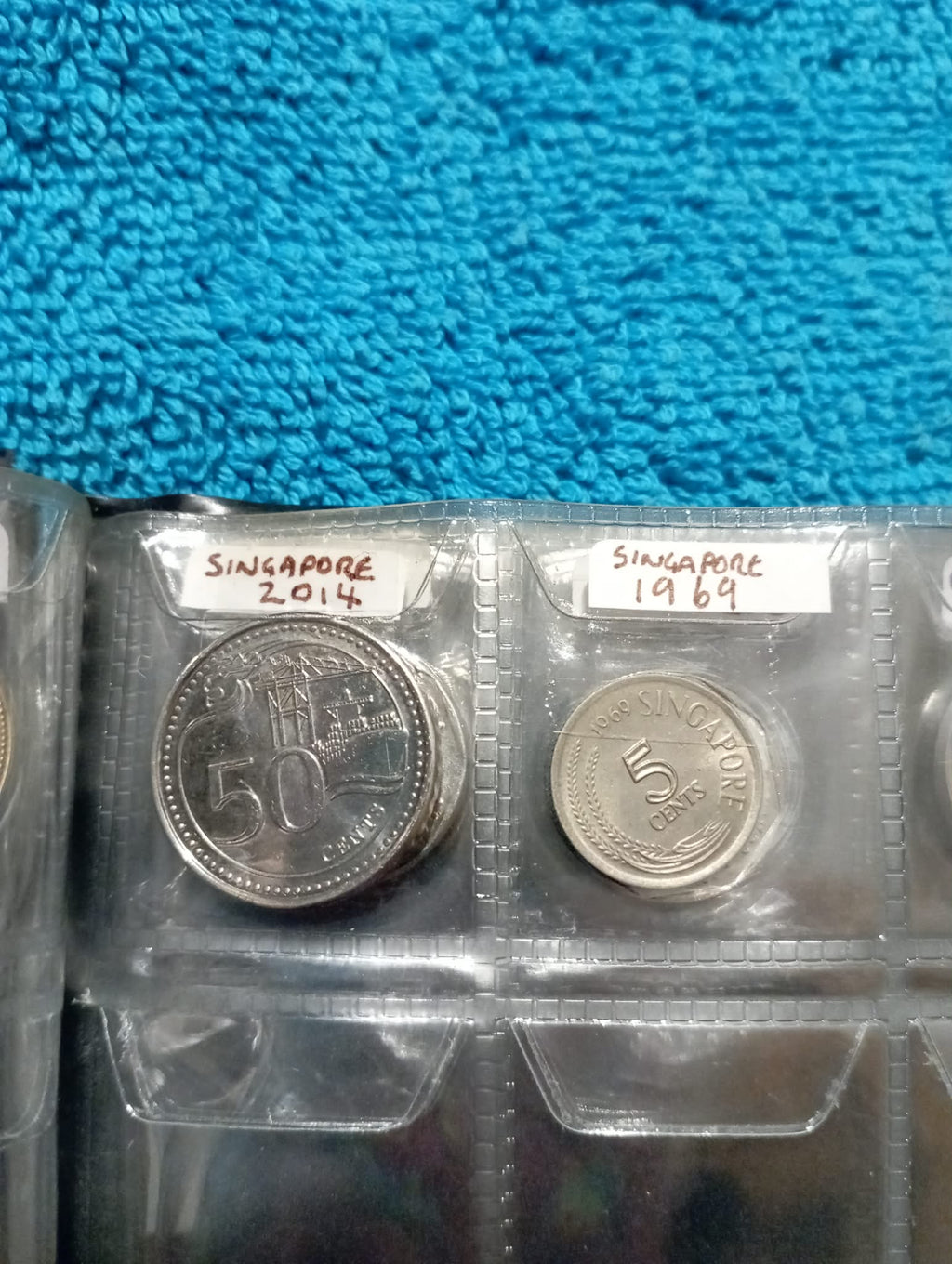 RED COIN BOOK WITH 11 COINS