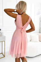 Numoco elegant cocktail dress with a wrap neckline and bow