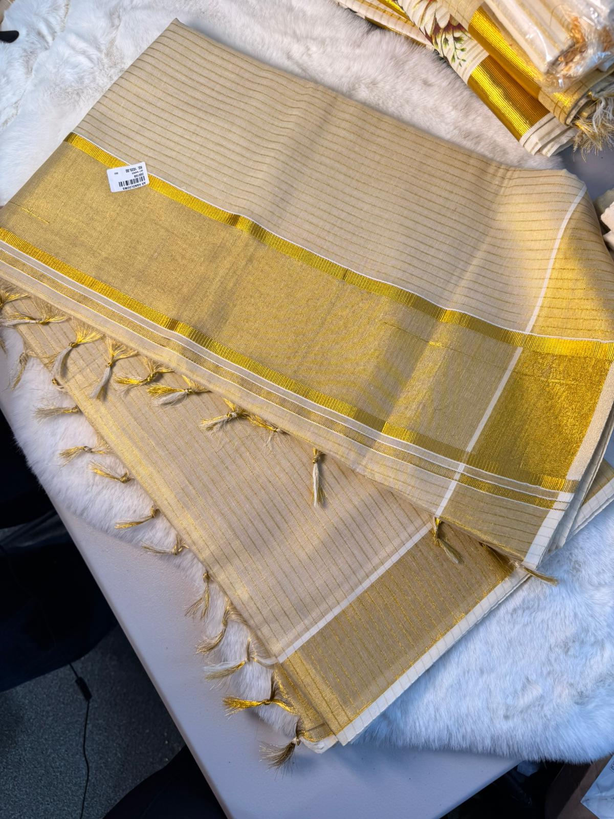 Golden Stripe Kerala Kasavu Saree with Tassel Detailing