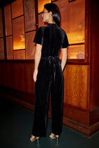 Yumi Black Velvet Jumpsuit With Twist Neckline And Buckle Belt