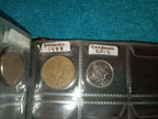 RED COIN BOOK WITH 11 COINS