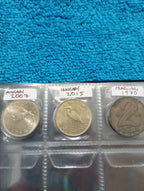 RED COIN BOOK WITH 11 COINS