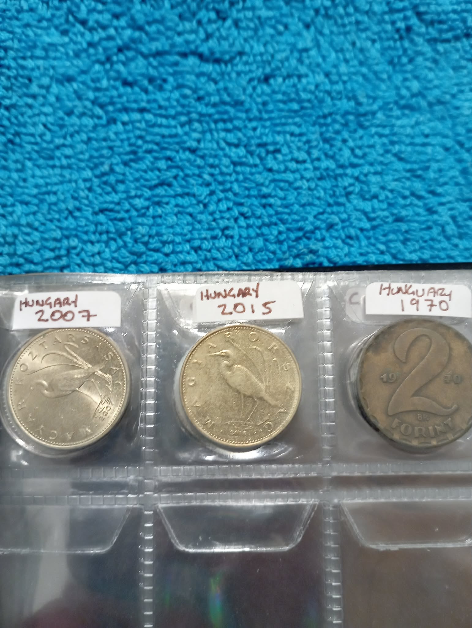RED COIN BOOK WITH 11 COINS