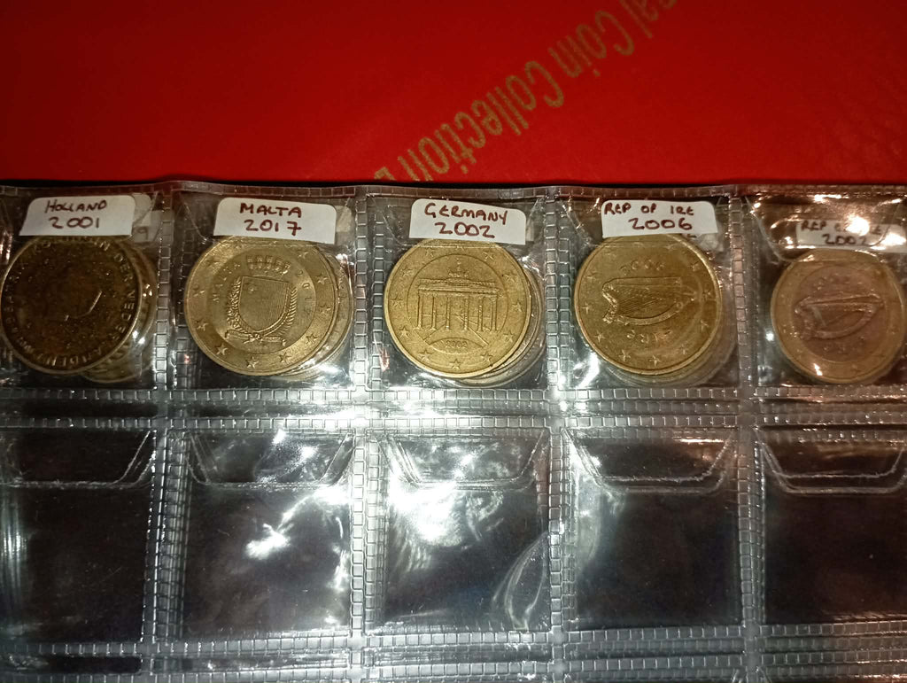 RED COIN BOOK WITH 44 CENT AND EURO COINS