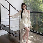 Apricotcolored Longsleeved Dress With A Cinched Waist Slimming Effect And Ethereal Ruffled Hem
