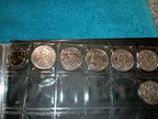 RED COIN BOOK WITH 13 COINS