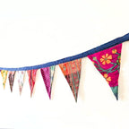Upcycled sari flags, reusable sari bunting