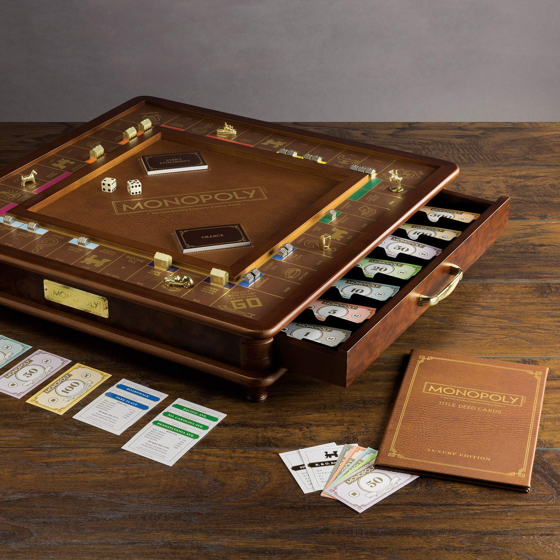 Monopoly Luxury Edition by WS Game Company — Burl Wood Cabinet, Gold Foil Stamped Game Board, Faux Leather Rolling Area, and 2 Storage Drawers