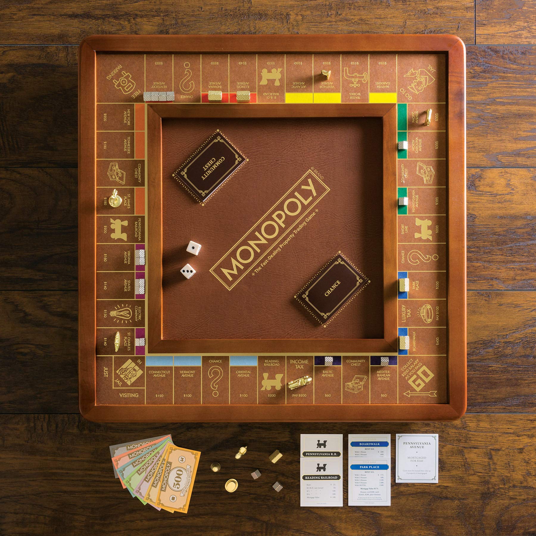 Monopoly Luxury Edition by WS Game Company — Burl Wood Cabinet, Gold Foil Stamped Game Board, Faux Leather Rolling Area, and 2 Storage Drawers