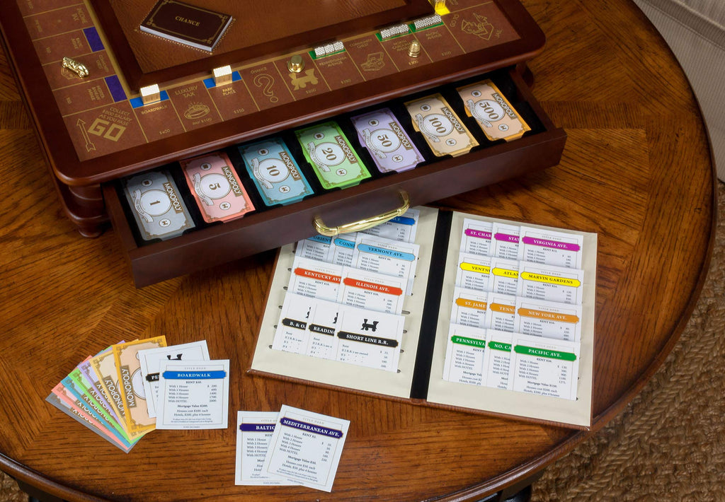 Monopoly Luxury Edition by WS Game Company — Burl Wood Cabinet, Gold Foil Stamped Game Board, Faux Leather Rolling Area, and 2 Storage Drawers